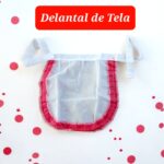 DELANTAL DE TELA NEGRITA (BORDES ROJO)